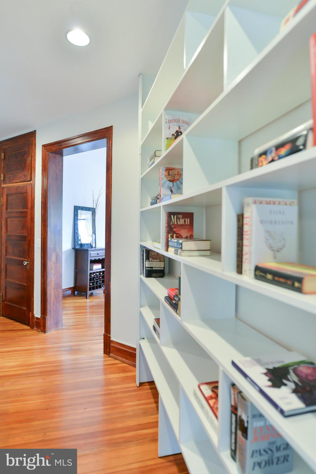 2852 Ontario Road Northwest, Unit 22 Washington, DC 20009 - Photo 24 of 30 a hallway with a wooden floor
