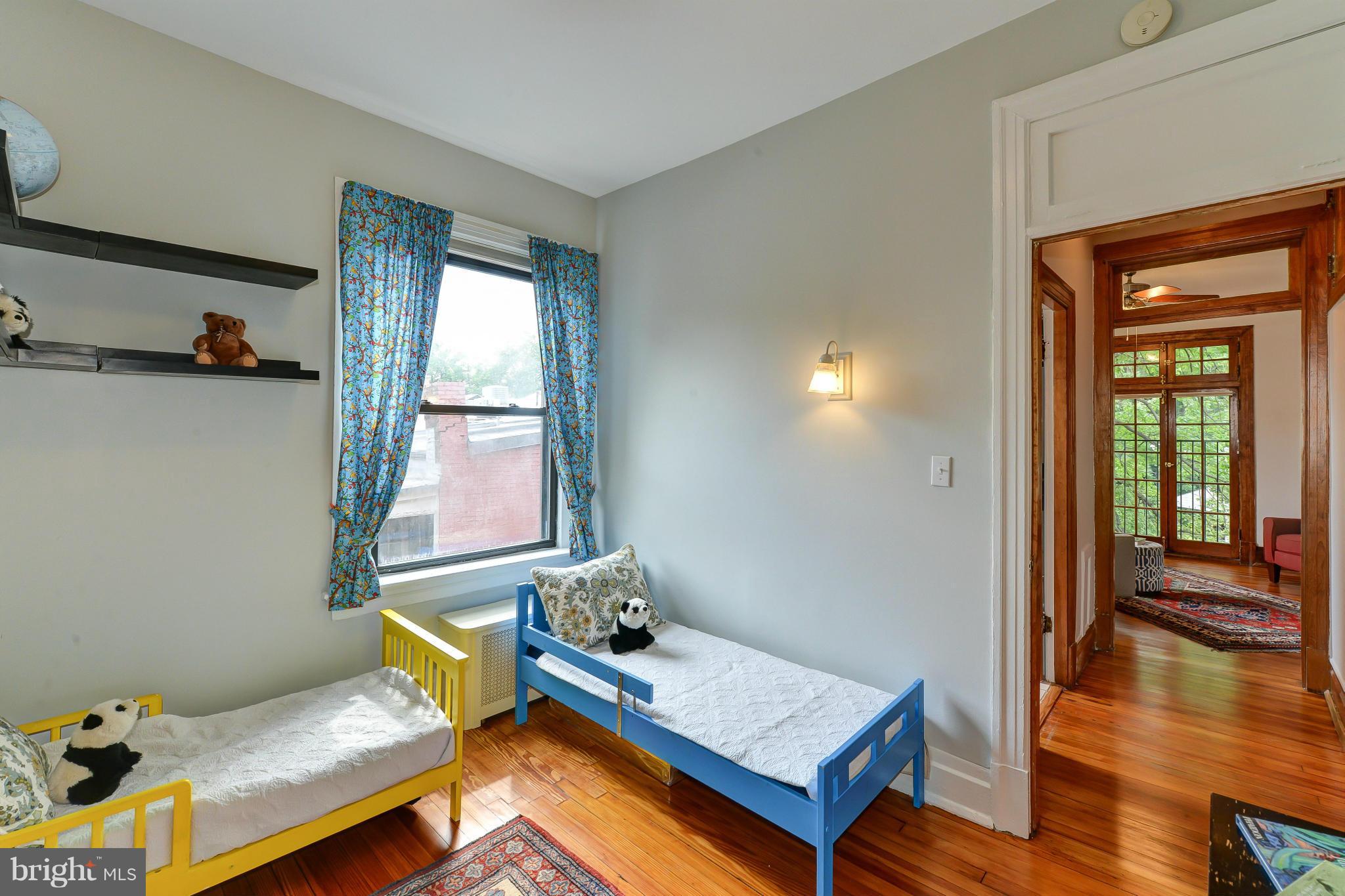 2852 Ontario Road Northwest, Unit 22 Washington, DC 20009 - Photo 25 of 30 a living room with furniture and a window
