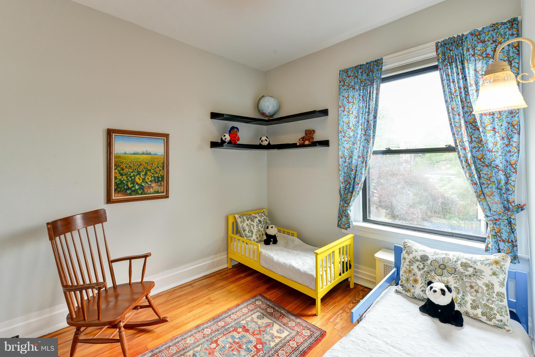 2852 Ontario Road Northwest, Unit 22 Washington, DC 20009 - Photo 26 of 30 a living room with furniture and a window