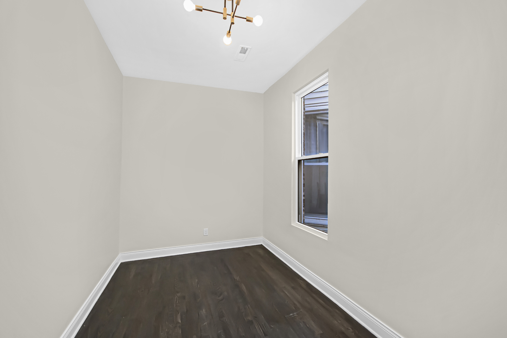 1337 North Western Avenue, Unit 3 Chicago, IL 60622 - Photo 11 of 17 an empty room with wooden floor and windows
