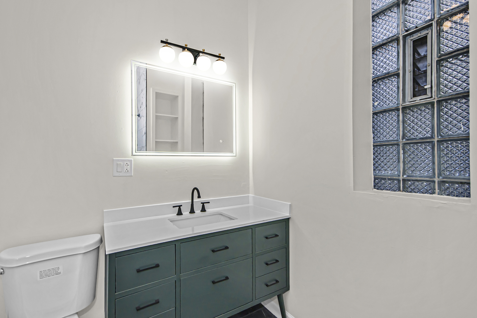 1337 North Western Avenue, Unit 3 Chicago, IL 60622 - Photo 13 of 17 a bathroom with a sink and a mirror