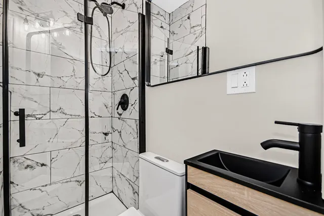 a bathroom with a bathtub and shower