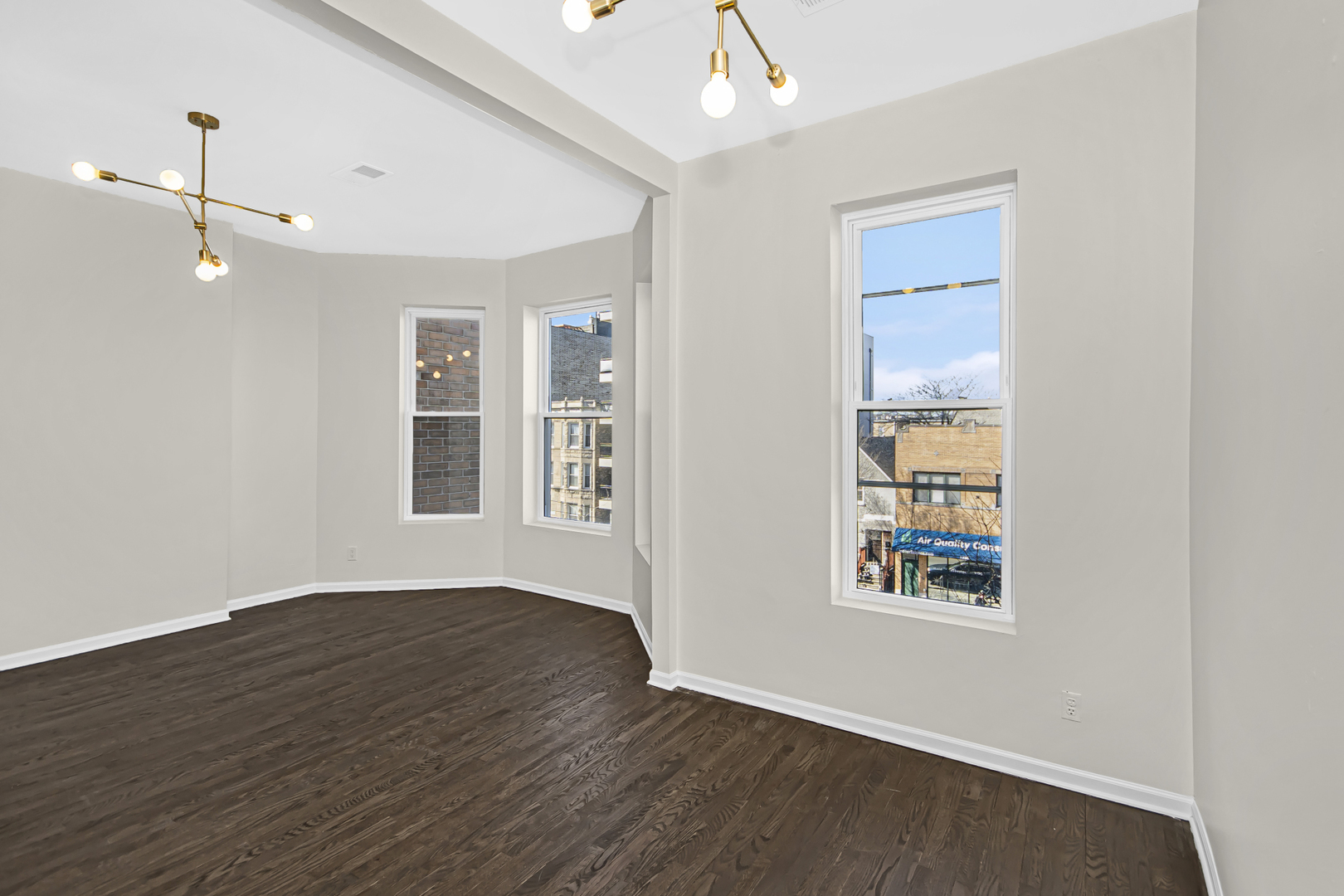 1337 North Western Avenue, Unit 3 Chicago, IL 60622 - Photo 5 of 17 wooden floor in an empty room with a window