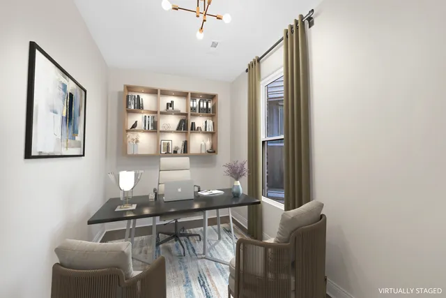 a workspace with furniture and window