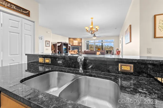 a kitchen with a sink a counter and cabinets
