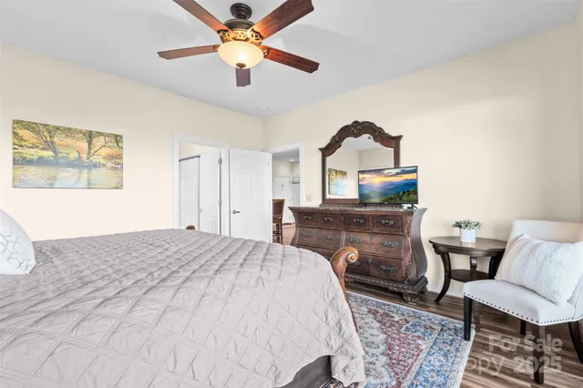 a bedroom with a bed and a dresser