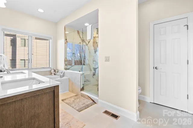 a spacious bathroom with a sink a mirror and a bathtub