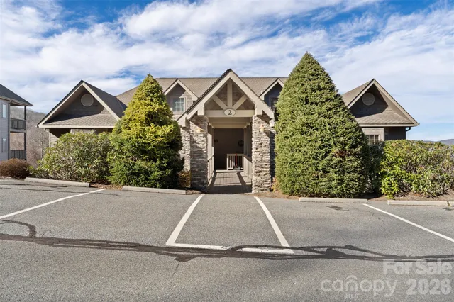 a front view of a house with yard