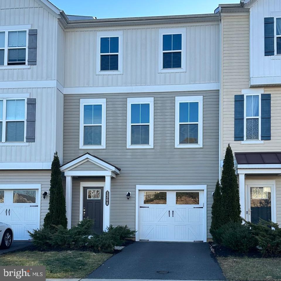1308 Teagan Drive Fredericksburg, VA 22408 - Photo 1 of 1 a front view of a house with garden