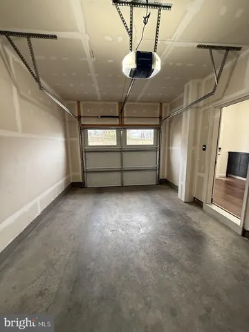 a large room with stainless steel appliances kitchen island a large island in the center