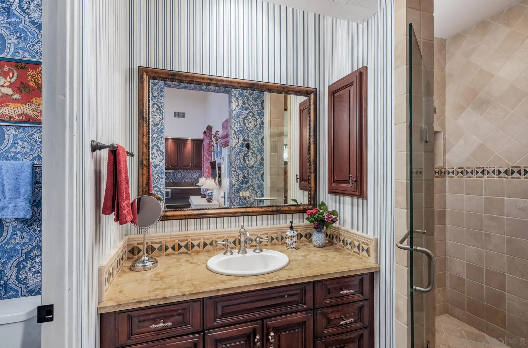 18669 Via Catania Rancho Santa Fe, CA 92091 - Photo 27 of 39 a en suite bathroom with a granite countertop sink and a mirror