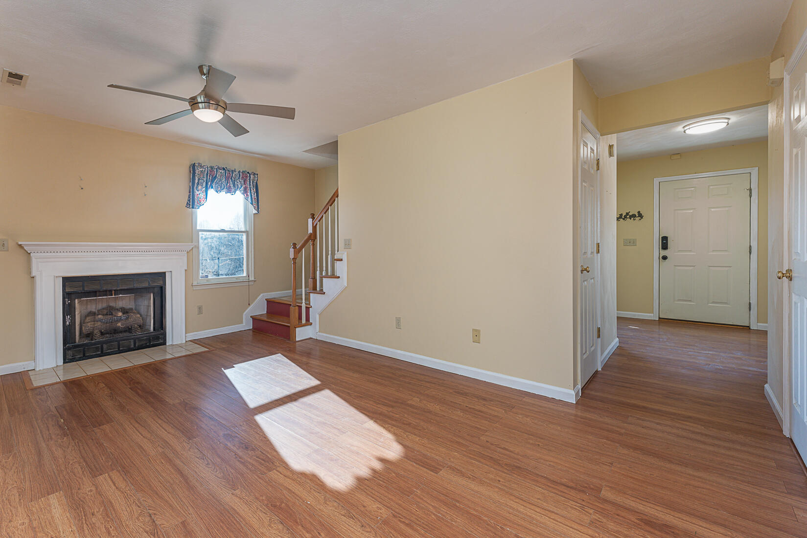 3490 Saunders Road Vinton, VA 24179 - Photo 13 of 60 a view of an empty room with wooden floor fireplace and a window