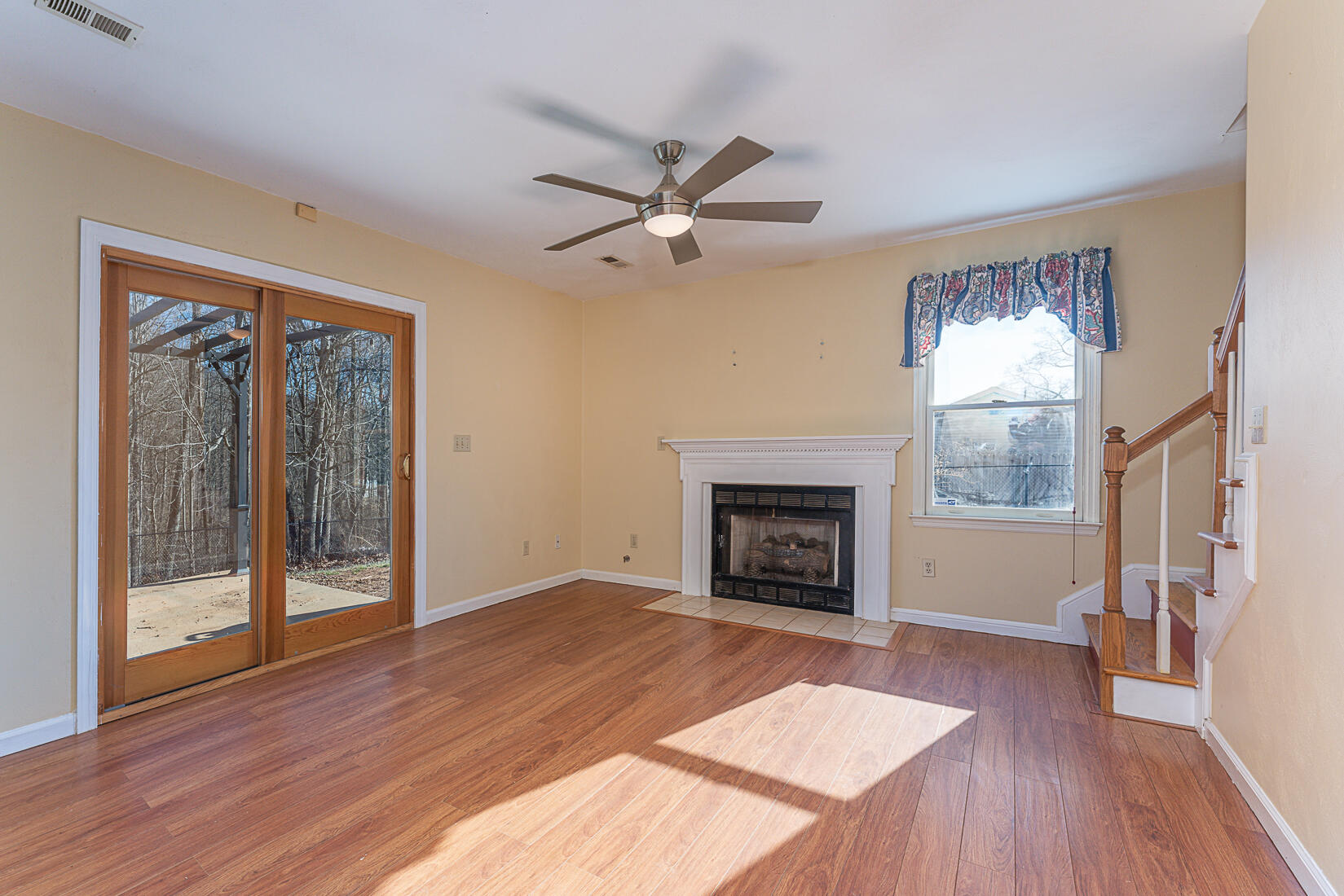 3490 Saunders Road Vinton, VA 24179 - Photo 14 of 60 wooden floor fireplace and windows in an empty room