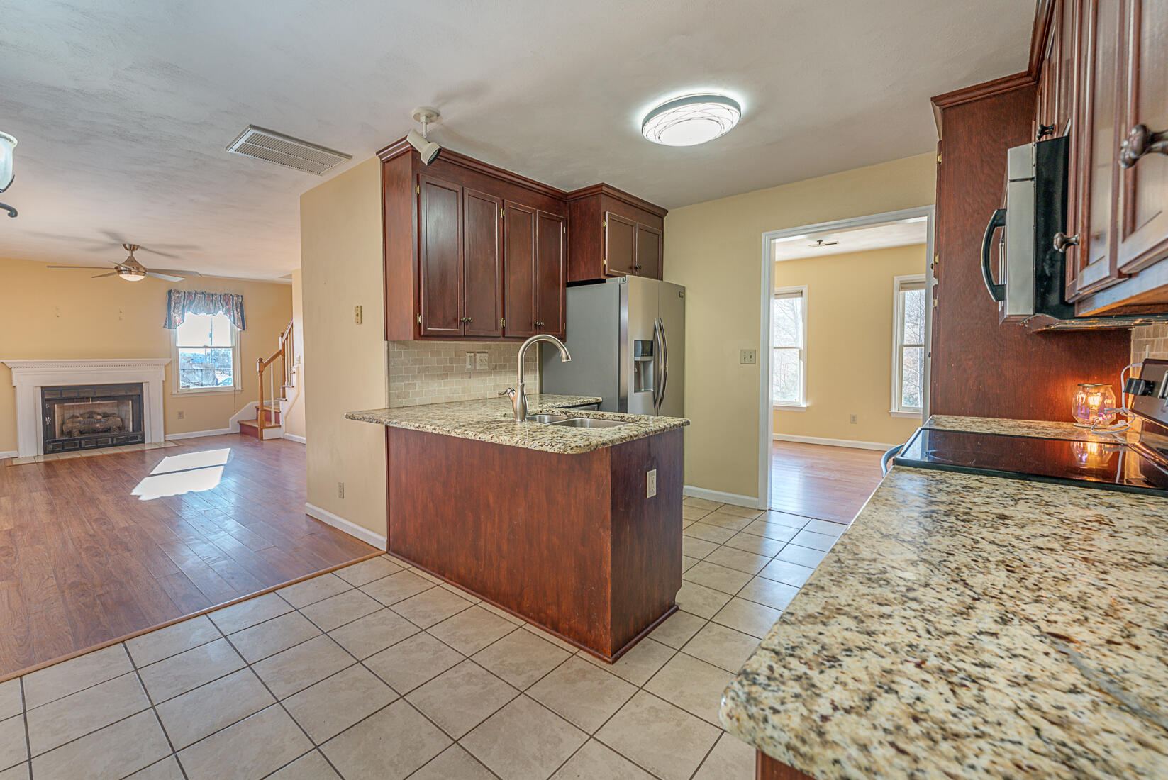 3490 Saunders Road Vinton, VA 24179 - Photo 19 of 60 a kitchen with granite countertop a sink and a stove top oven