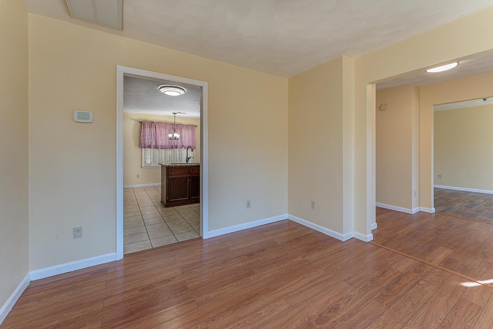 3490 Saunders Road Vinton, VA 24179 - Photo 23 of 60 a view of a hallway with wooden floor and a fireplace