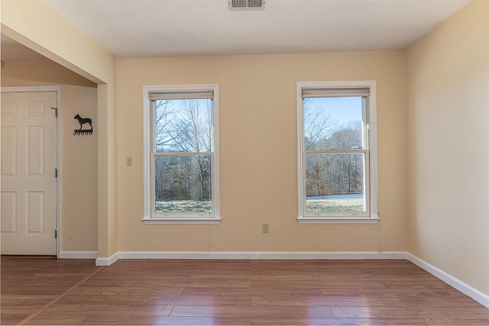 3490 Saunders Road Vinton, VA 24179 - Photo 24 of 60 a view of an empty room with wooden floor and a window