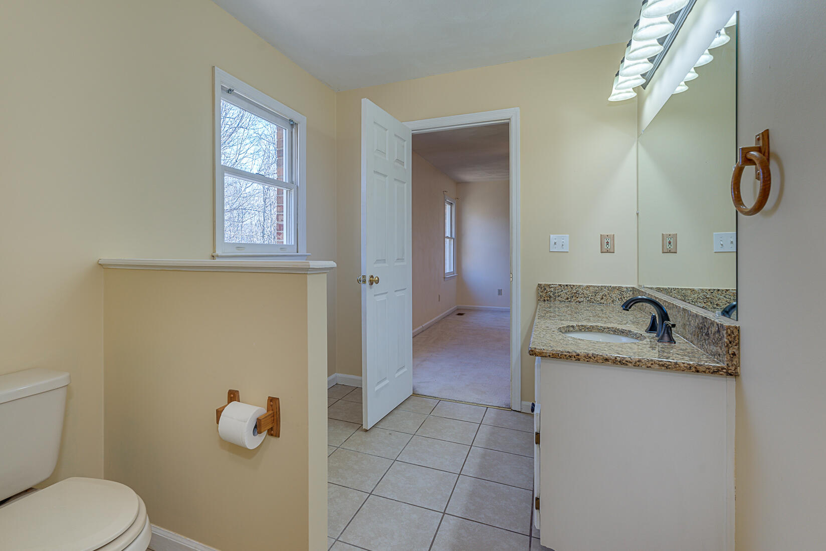 3490 Saunders Road Vinton, VA 24179 - Photo 46 of 60 a bathroom with a granite countertop toilet sink and mirror