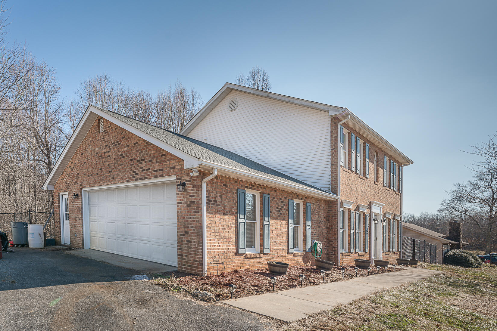 3490 Saunders Road Vinton, VA 24179 - Photo 50 of 60 a front view of a house with a yard and garage