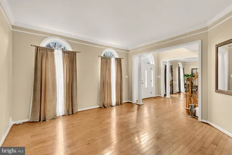 a view of front door with dining room and stairs