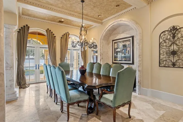 a living room with furniture fireplace and a large window