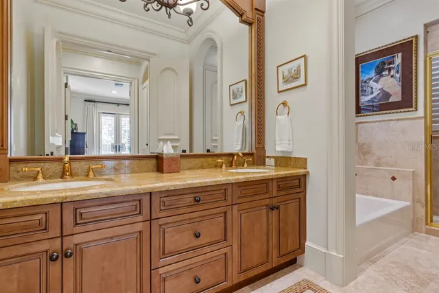 a bathroom with a granite countertop sink a toilet and a mirror