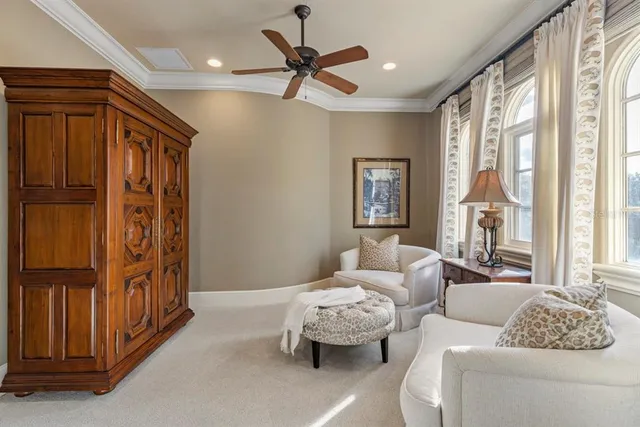 a view of a house with pool and trees in the background