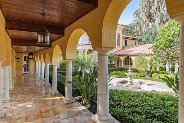 a view of a house with a yard and tree s
