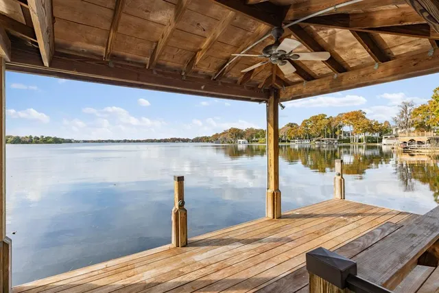 a front view of a house with garden and patio