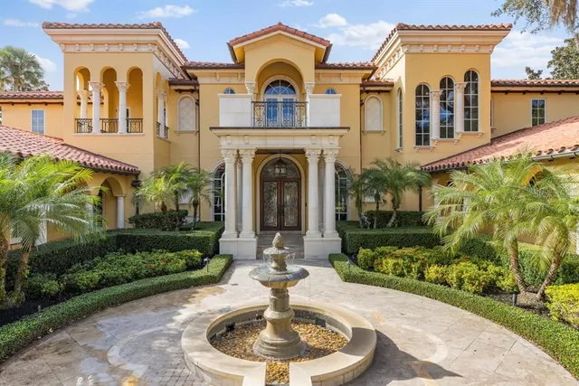 a large kitchen with stainless steel appliances granite countertop a lot of counter space and wooden floors