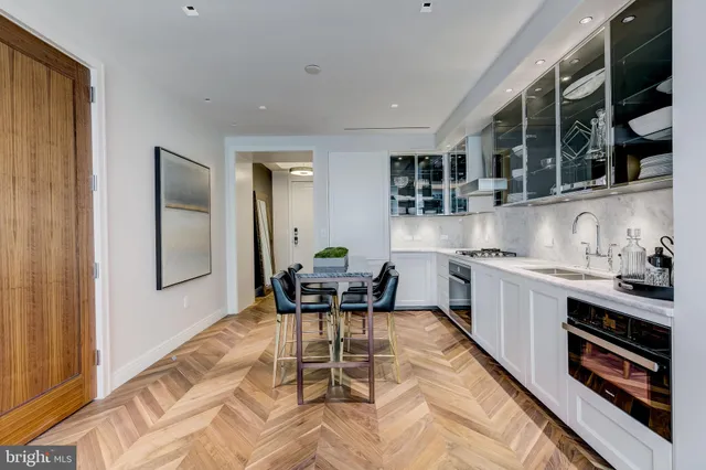 a kitchen with stainless steel appliances granite countertop a stove and a sink