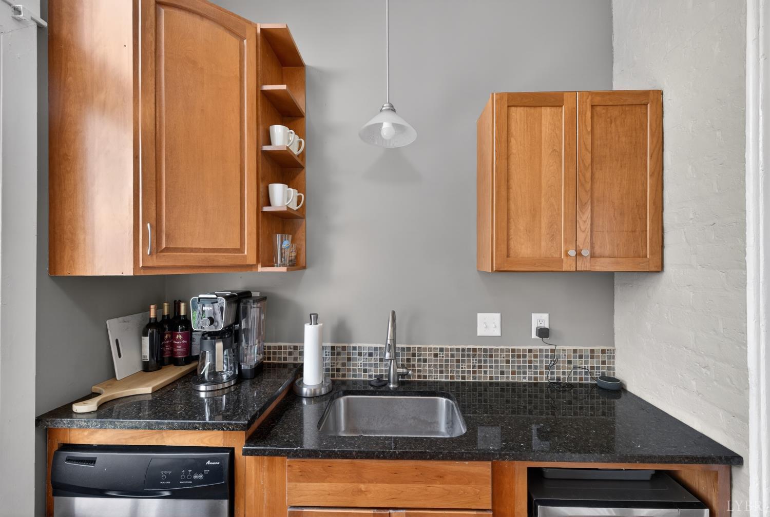 1007 Court Street Lynchburg, VA 24504 - Photo 21 of 90 a kitchen with sink a microwave and cabinets