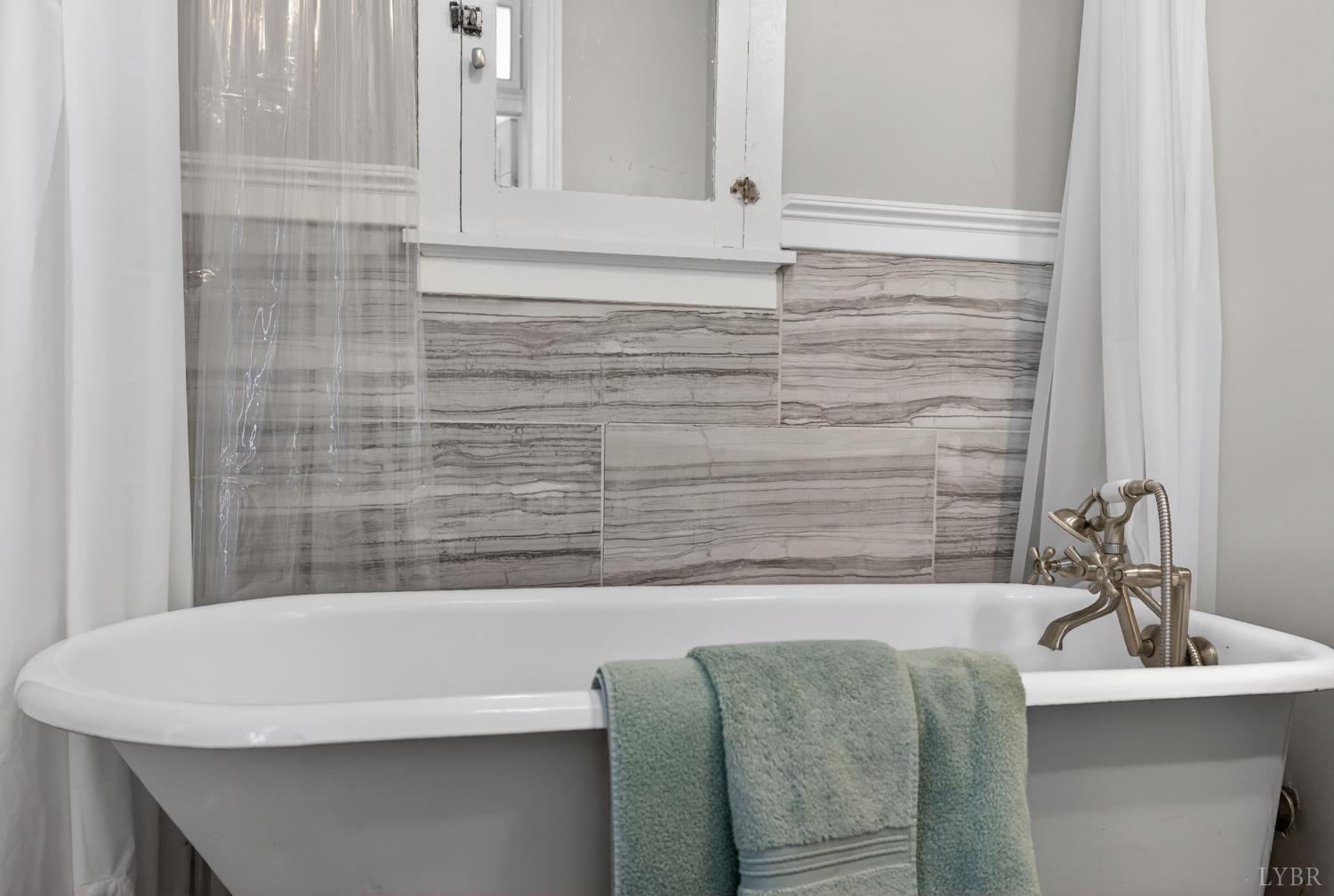 1007 Court Street Lynchburg, VA 24504 - Photo 37 of 90 a bathroom with a sink and a bathtub