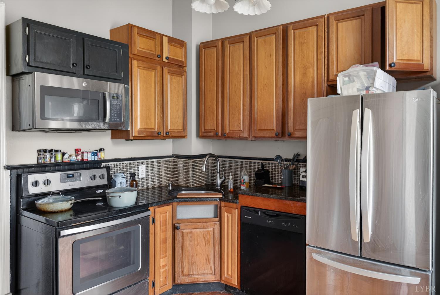 1007 Court Street Lynchburg, VA 24504 - Photo 46 of 90 a kitchen with stainless steel appliances granite countertop a refrigerator stove and sink