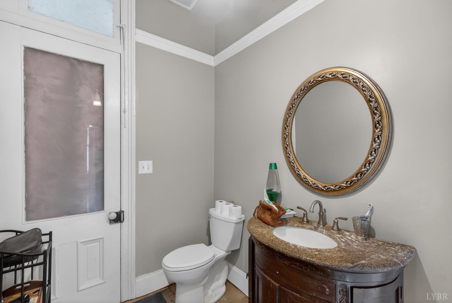 1007 Court Street Lynchburg, VA 24504 - Photo 50 of 90 a bathroom with a sink and a mirror