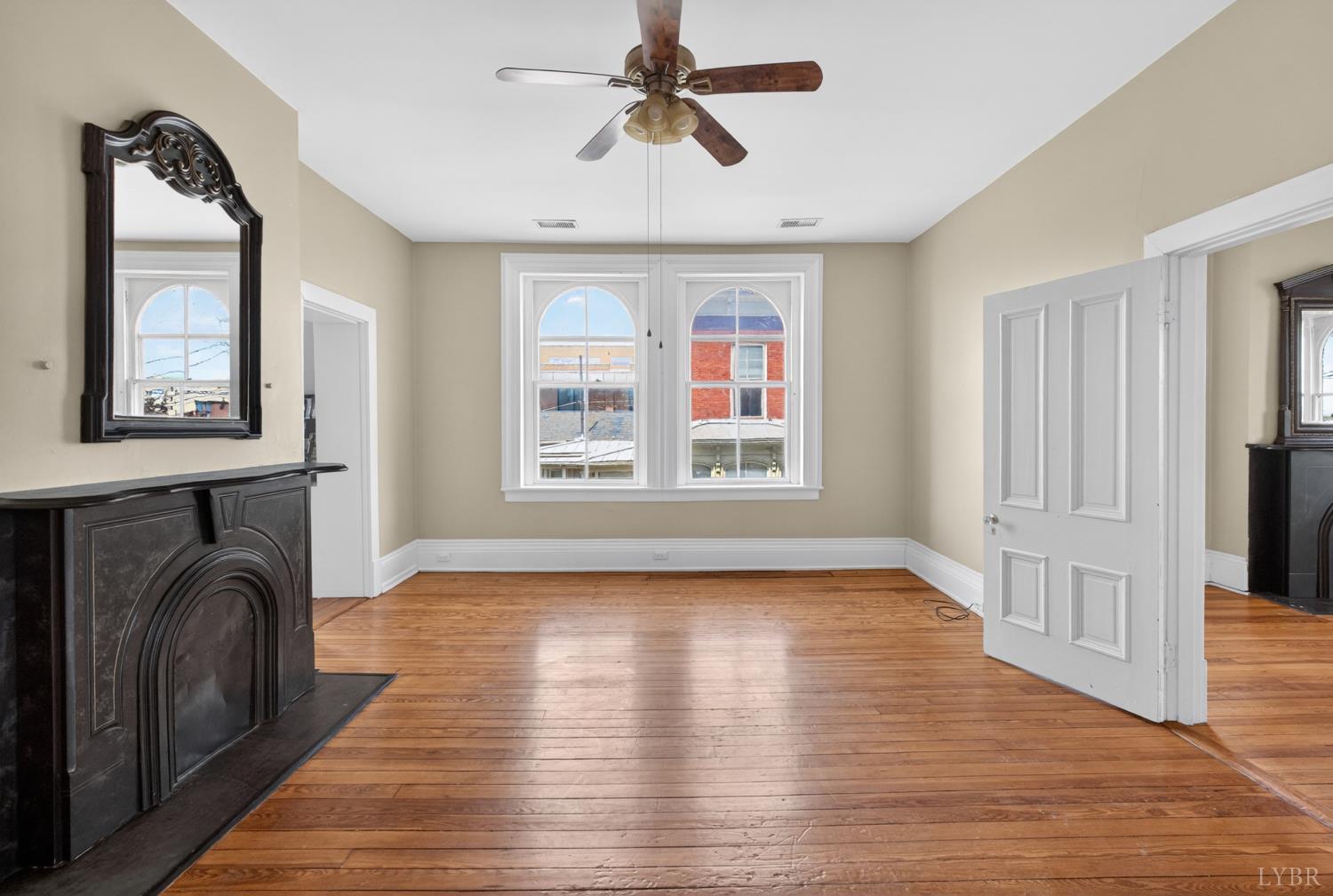 1007 Court Street Lynchburg, VA 24504 - Photo 57 of 90 a view of livingroom with furniture wooden floor fan and windows