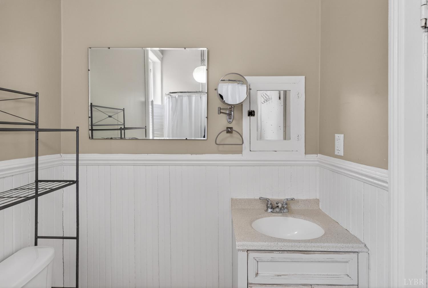 1007 Court Street Lynchburg, VA 24504 - Photo 60 of 90 a bathroom with a sink and a mirror