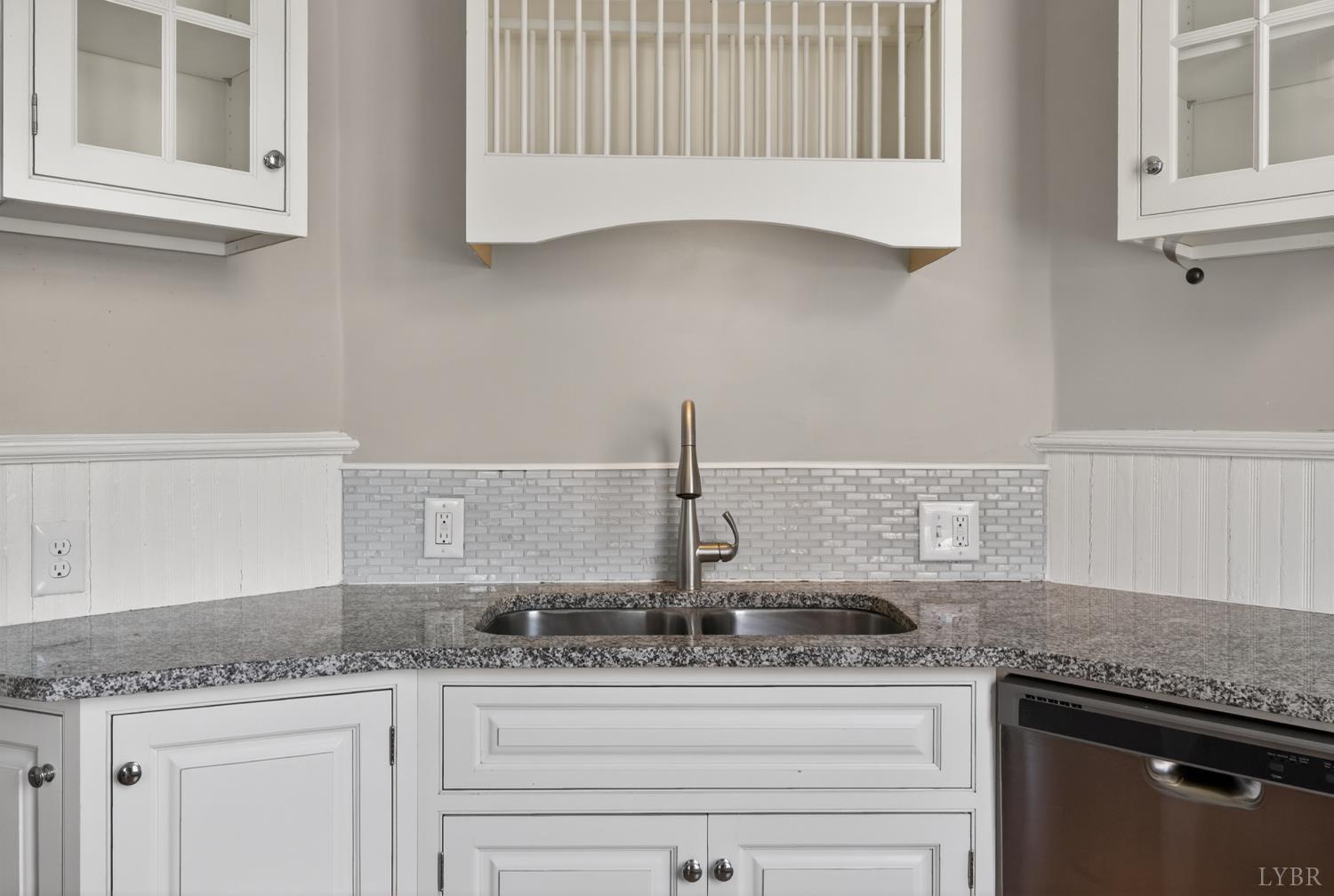 1007 Court Street Lynchburg, VA 24504 - Photo 63 of 90 a kitchen with granite countertop cabinets and window