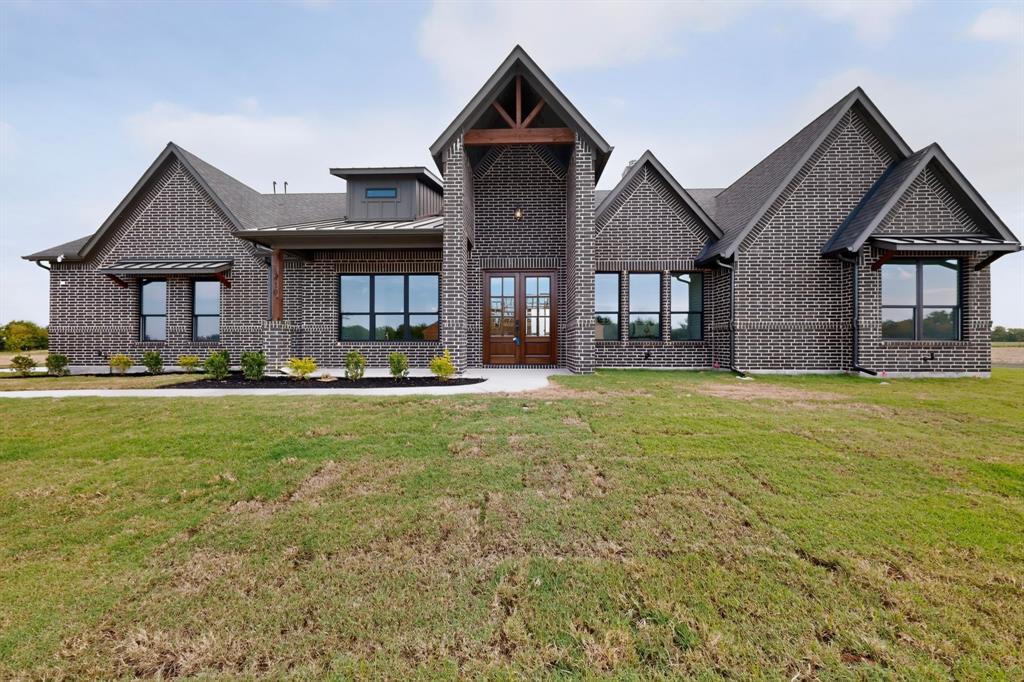5410 Sunset Road Caddo Mills, TX 75135 - Photo 2 of 40 Brick exterior with dark gray tones, prominent gables, large multi-pane windows, and a double-door entry