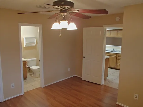 a view of a bathroom with a hardwood and a vanity