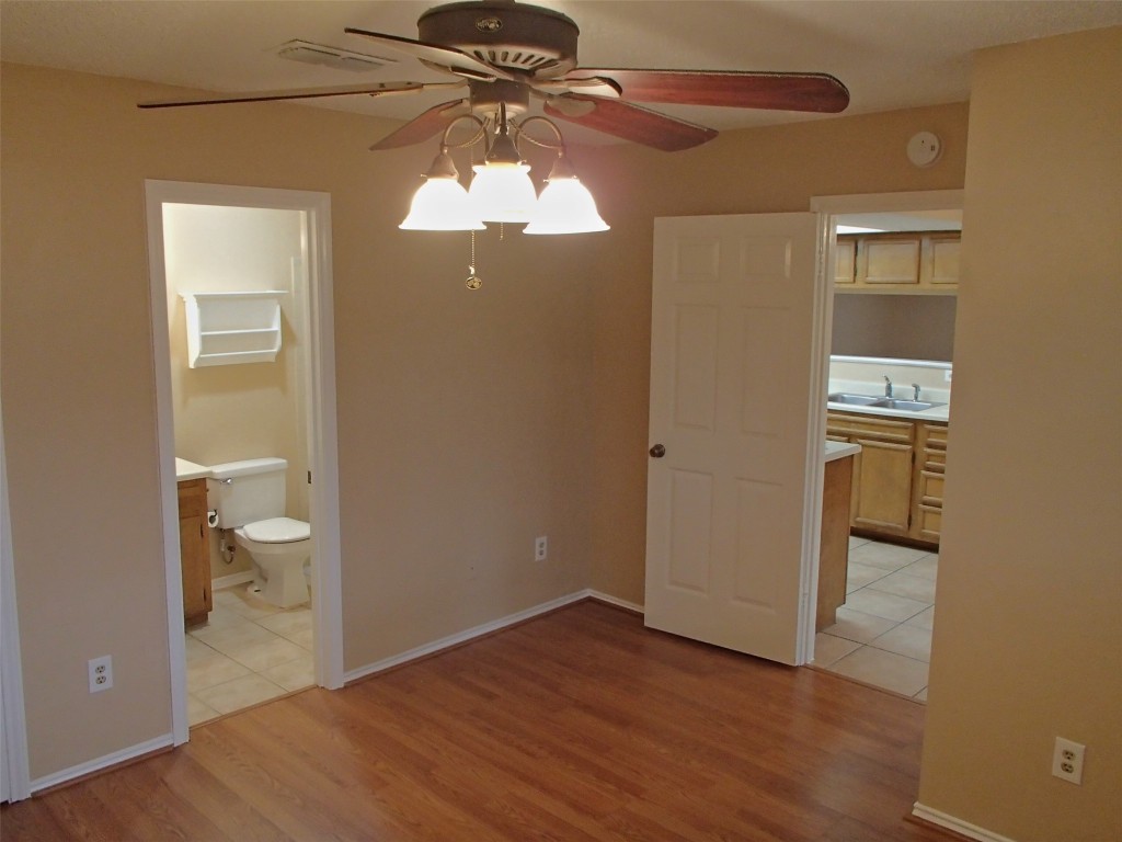 617 Luther Drive, Unit B Georgetown, TX 78628 - Photo 5 of 13 a view of a bathroom with a hardwood and a vanity