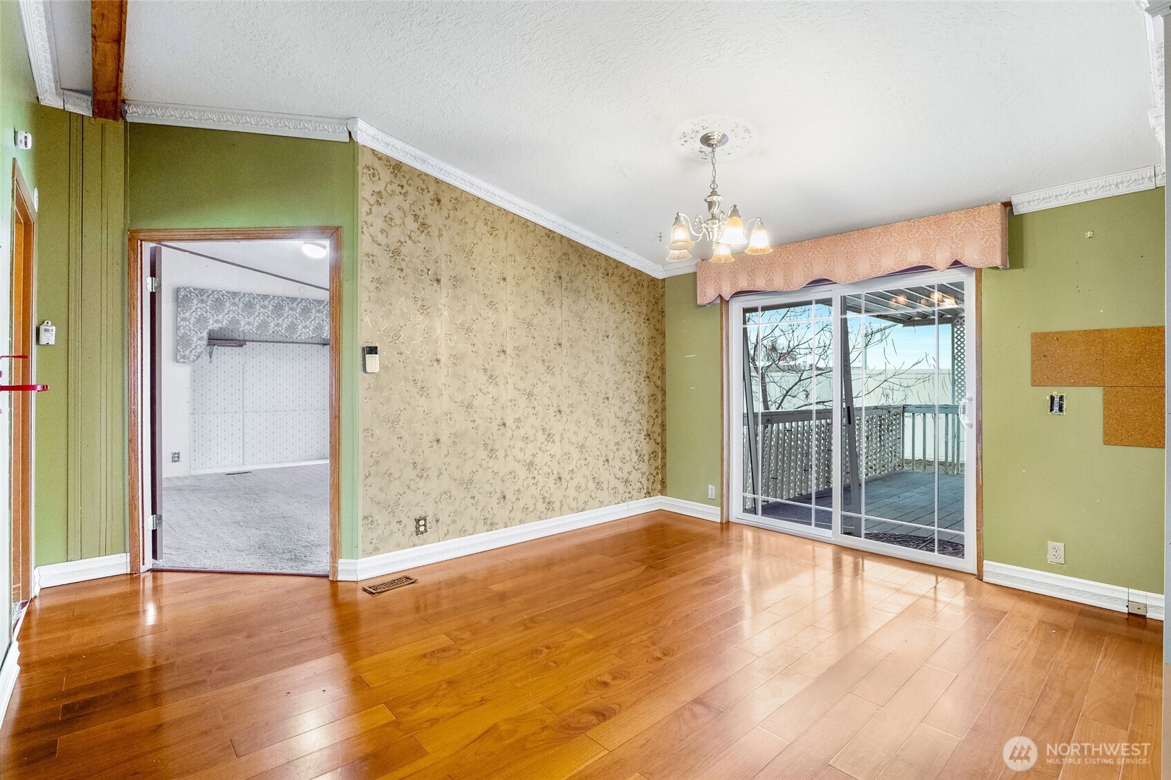 8674 Vince Road Northeast Moses Lake, WA 98837 - Photo 11 of 39 wooden floor in an empty room with a window