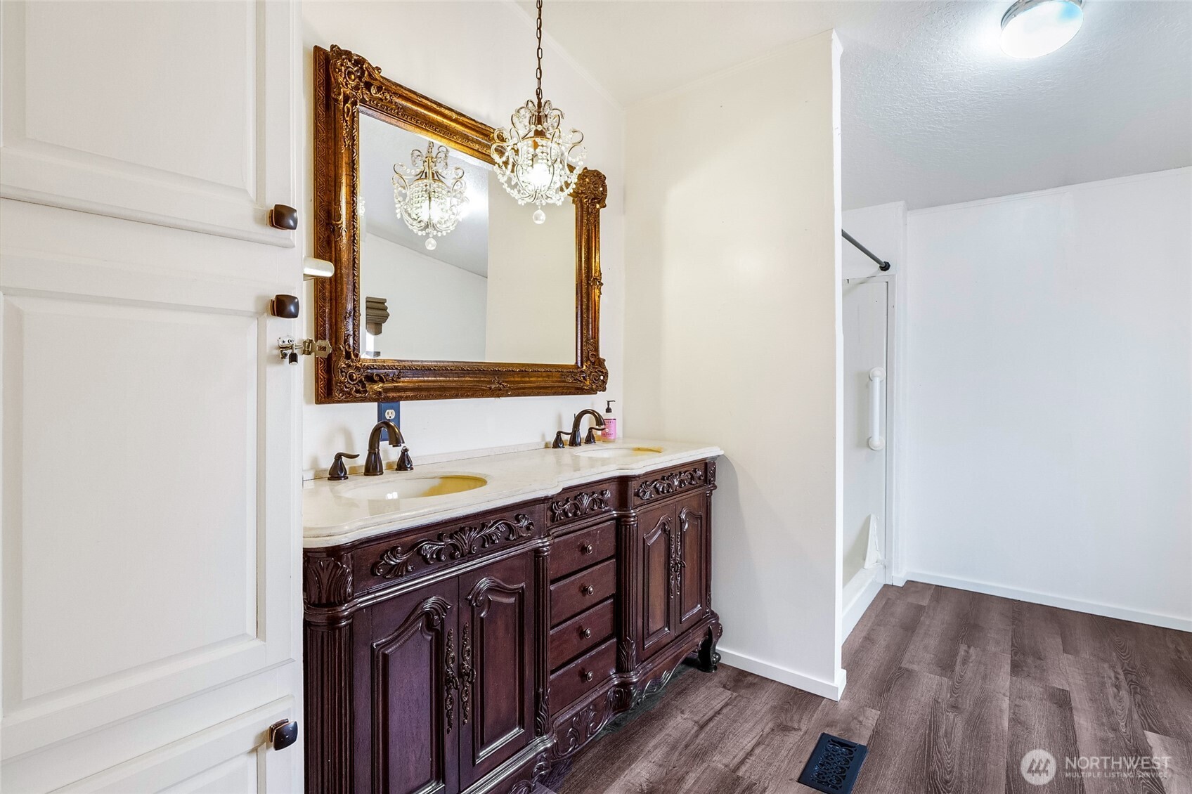 8674 Vince Road Northeast Moses Lake, WA 98837 - Photo 22 of 39 a bathroom with a double vanity sink and mirror