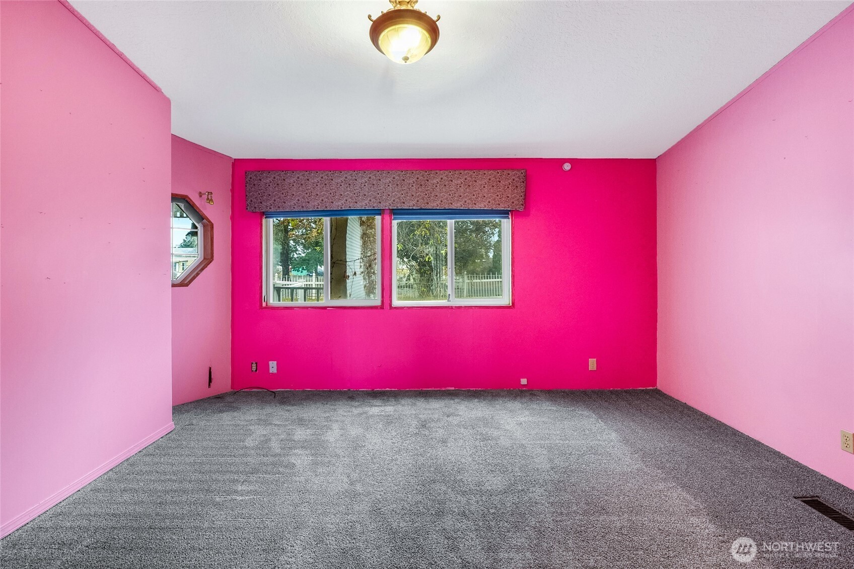8674 Vince Road Northeast Moses Lake, WA 98837 - Photo 24 of 39 a view of a room with wooden floor and windows