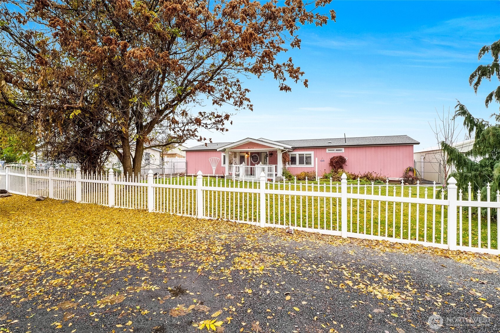 8674 Vince Road Northeast Moses Lake, WA 98837 - Photo 4 of 39 a view of a house with a yard and potted plants