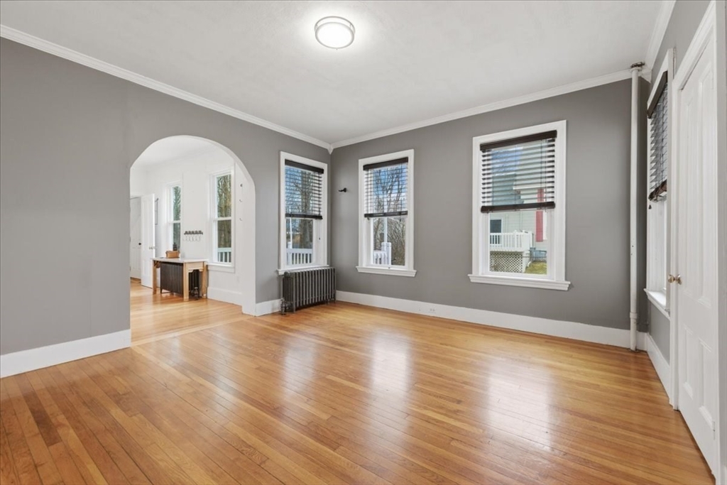 163 West Central Street Franklin, MA 02038 - Photo 16 of 39 a view of a livingroom with wooden floor and windows