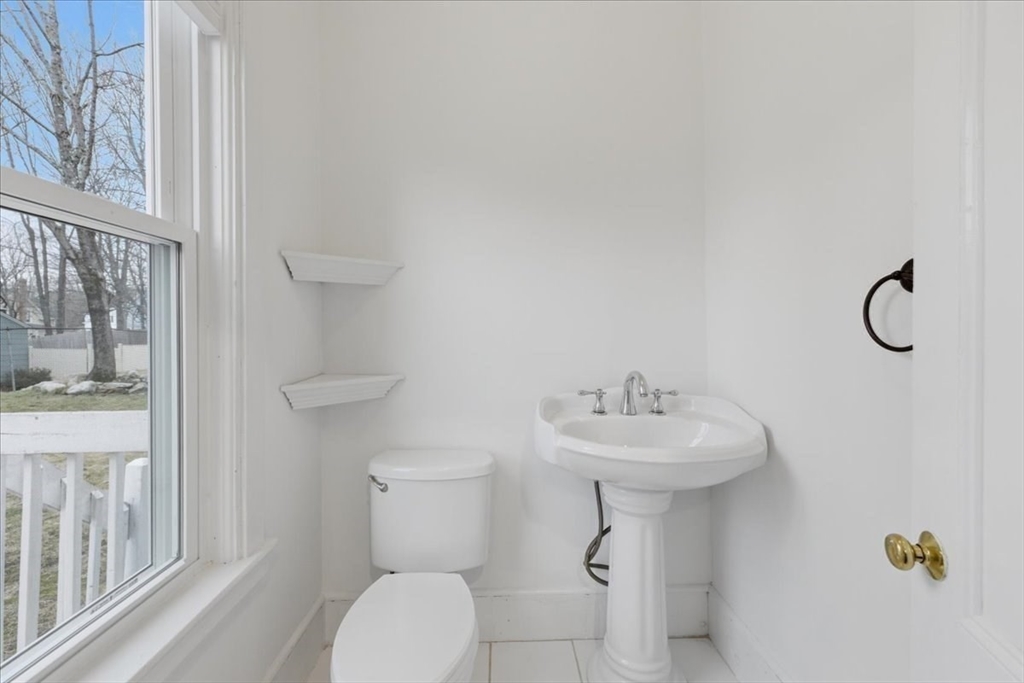 163 West Central Street Franklin, MA 02038 - Photo 23 of 39 a bathroom with a sink a toilet and shower