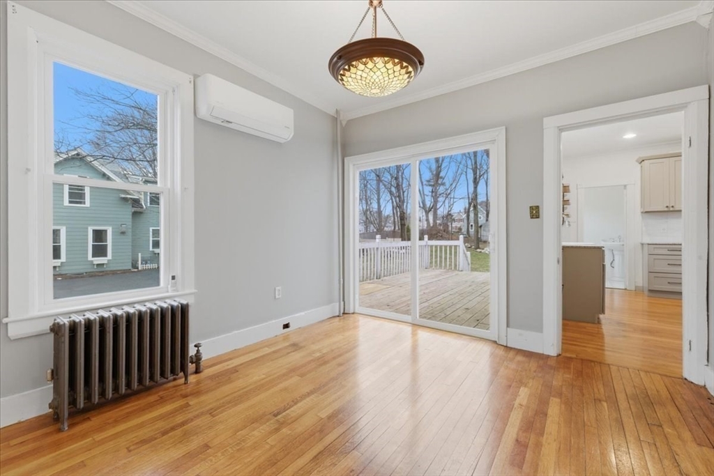 163 West Central Street Franklin, MA 02038 - Photo 25 of 39 a view of an empty room with wooden floor and a window
