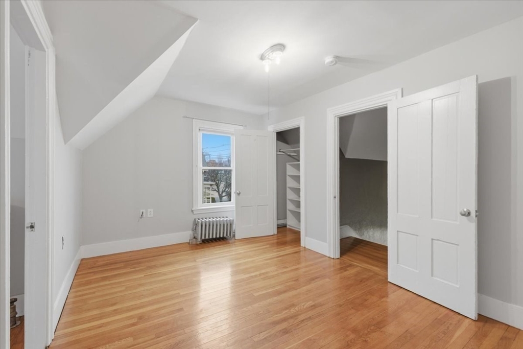 163 West Central Street Franklin, MA 02038 - Photo 34 of 39 an empty room with wooden floor and windows