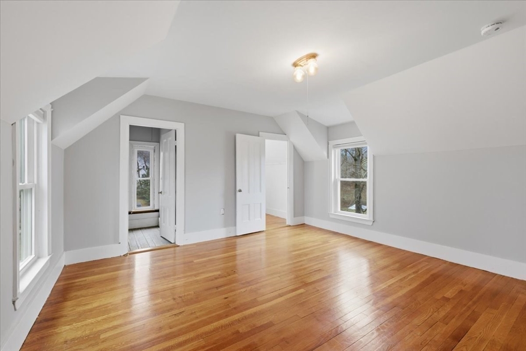 163 West Central Street Franklin, MA 02038 - Photo 36 of 39 a view of empty room with wooden floor and fan