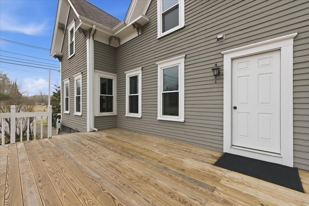 163 West Central Street Franklin, MA 02038 - Photo 37 of 39 a view of a house with a roof deck
